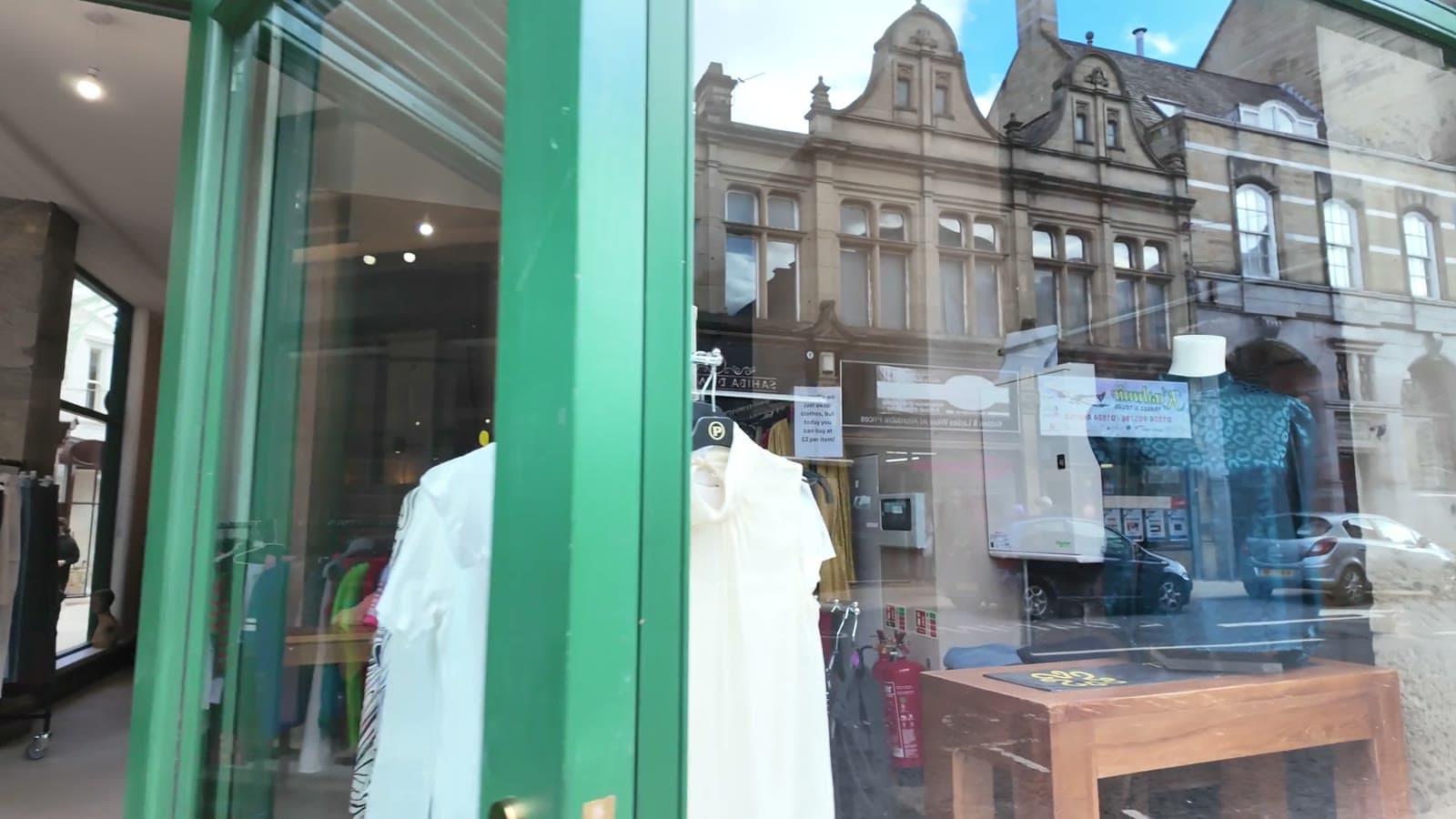 Menswear displayed in a boutique window