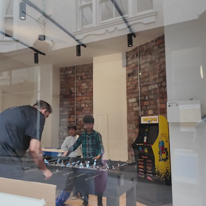Table football and arcade machines in the games room