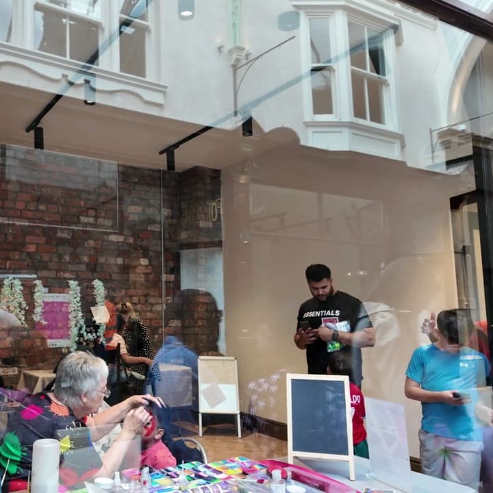 Makers at work behind the arcade glass