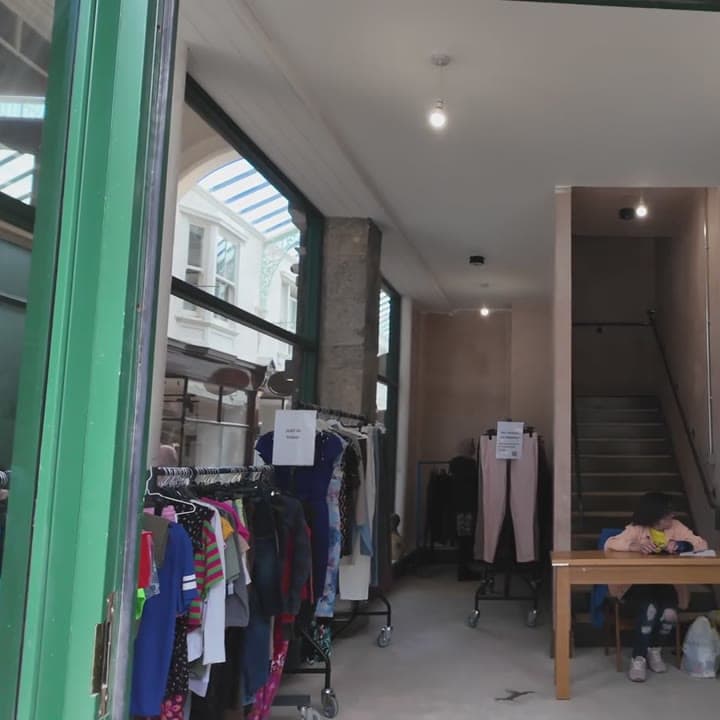 Colourful garments on boutique rails